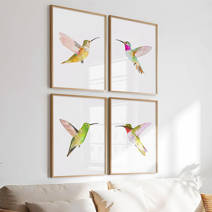 Living room with a wooden sofa, white cushions, and framed hummingbird artwork on the wall.