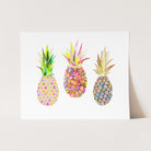 three pineapples are painted on a white card