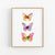 a painting of three butterflies on a white wall