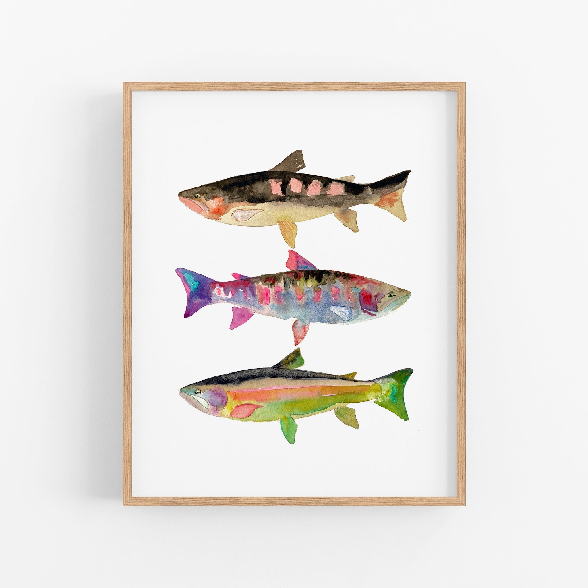 a painting of three fish on a white wall