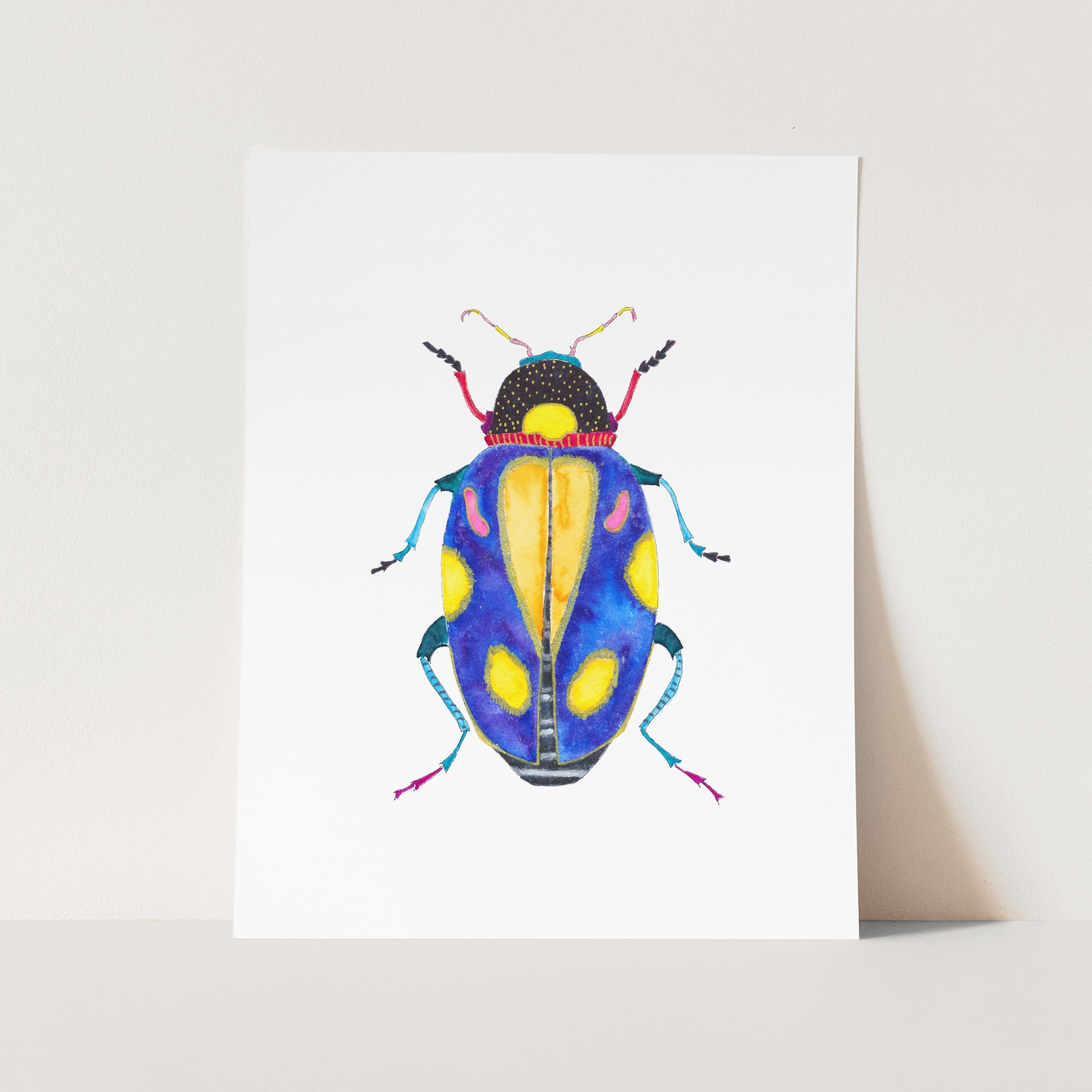 a blue and yellow bug on a white background