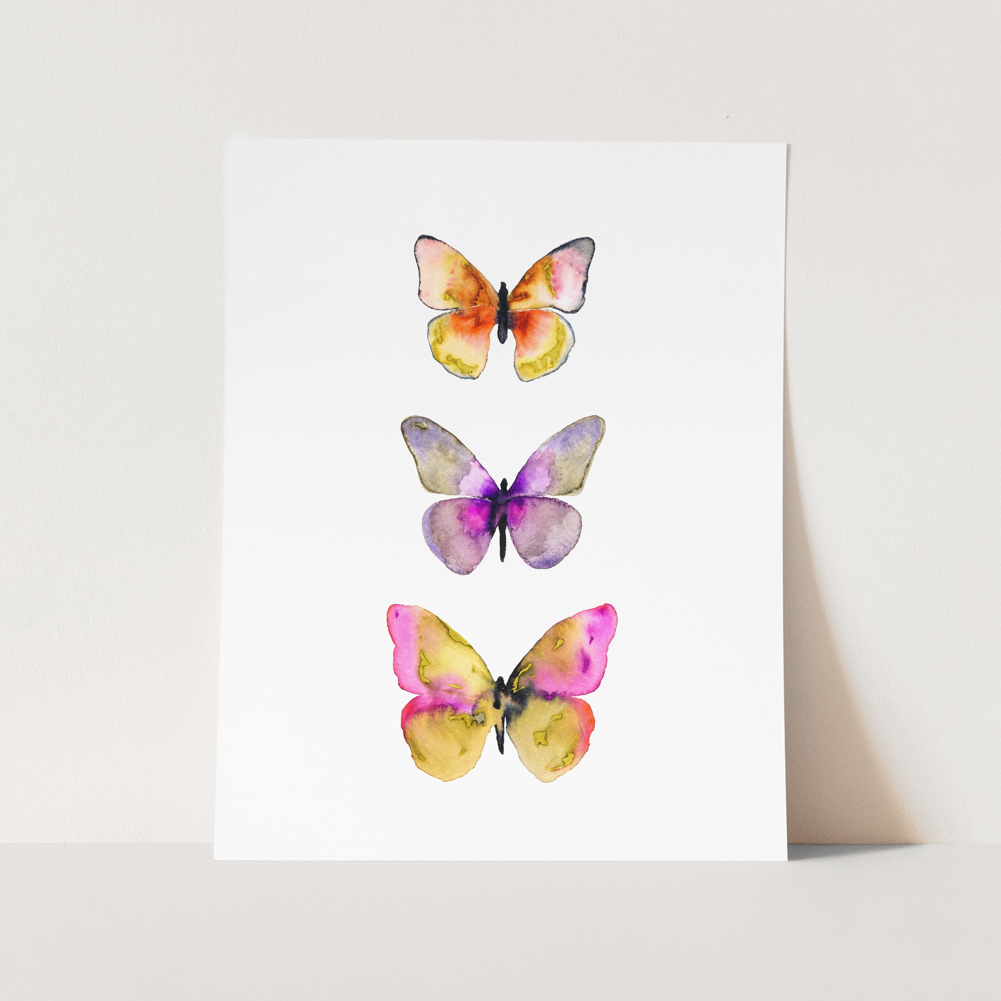 three watercolor butterflies on a white background