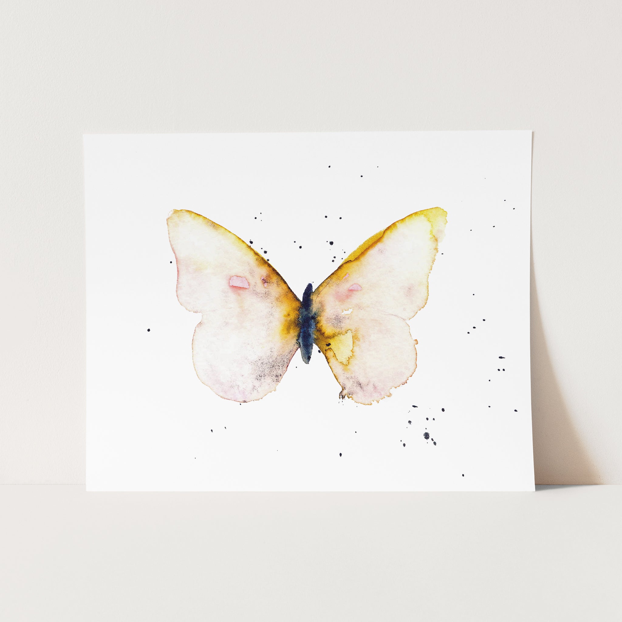 a watercolor painting of a yellow butterfly