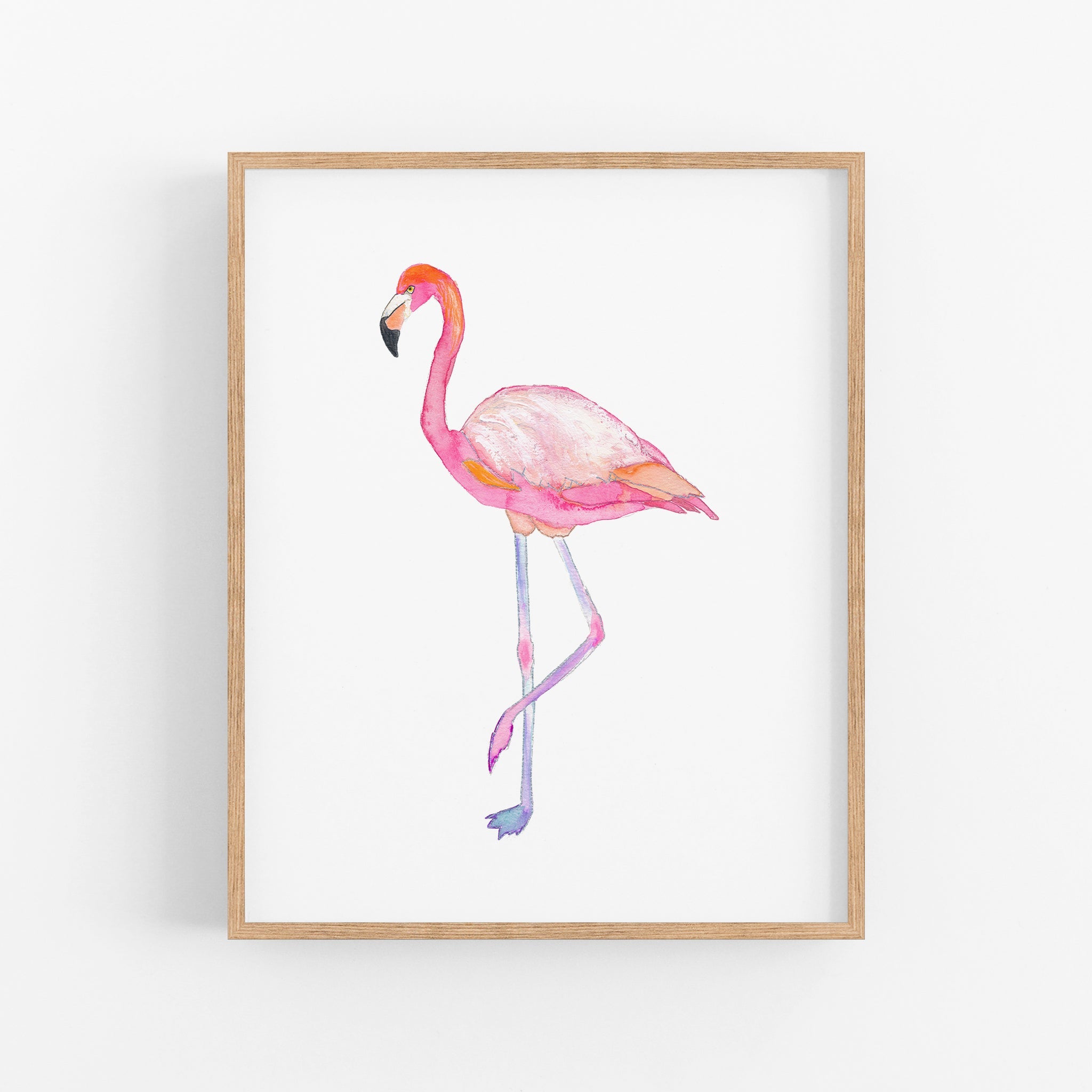 a pink flamingo standing in front of a white wall