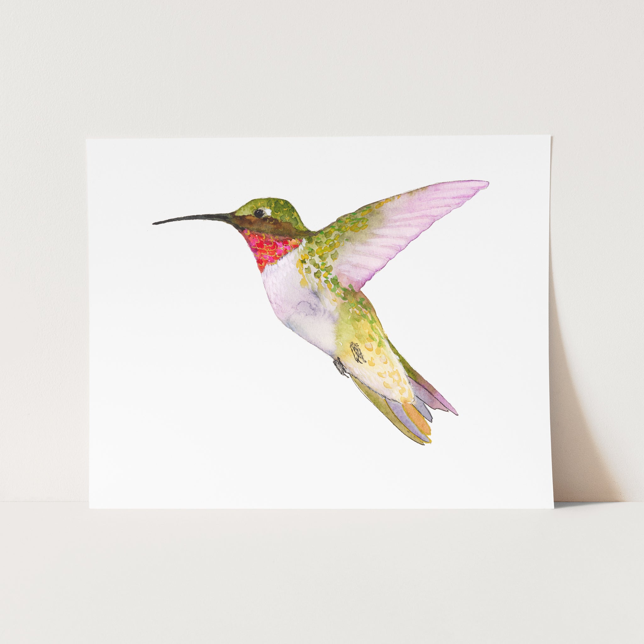 a card with a watercolor painting of a hummingbird