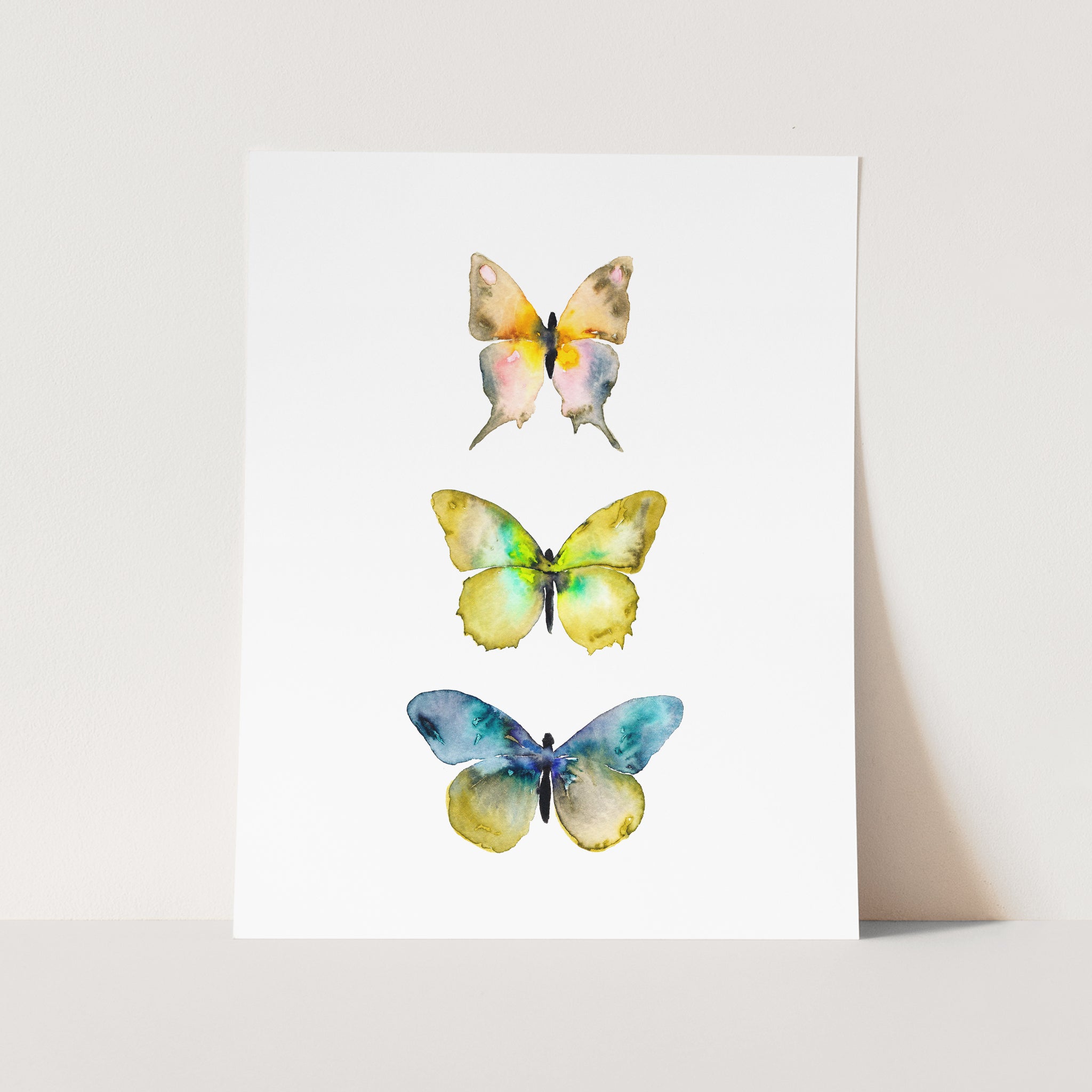 three watercolor butterflies on a white background