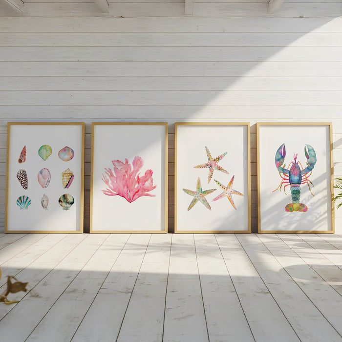Four framed artworks on a wall with a coastal theme in a sunlit room.
