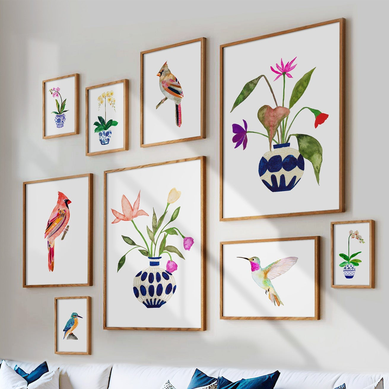 Wall art with colorful bird and floral designs in a living room setting.