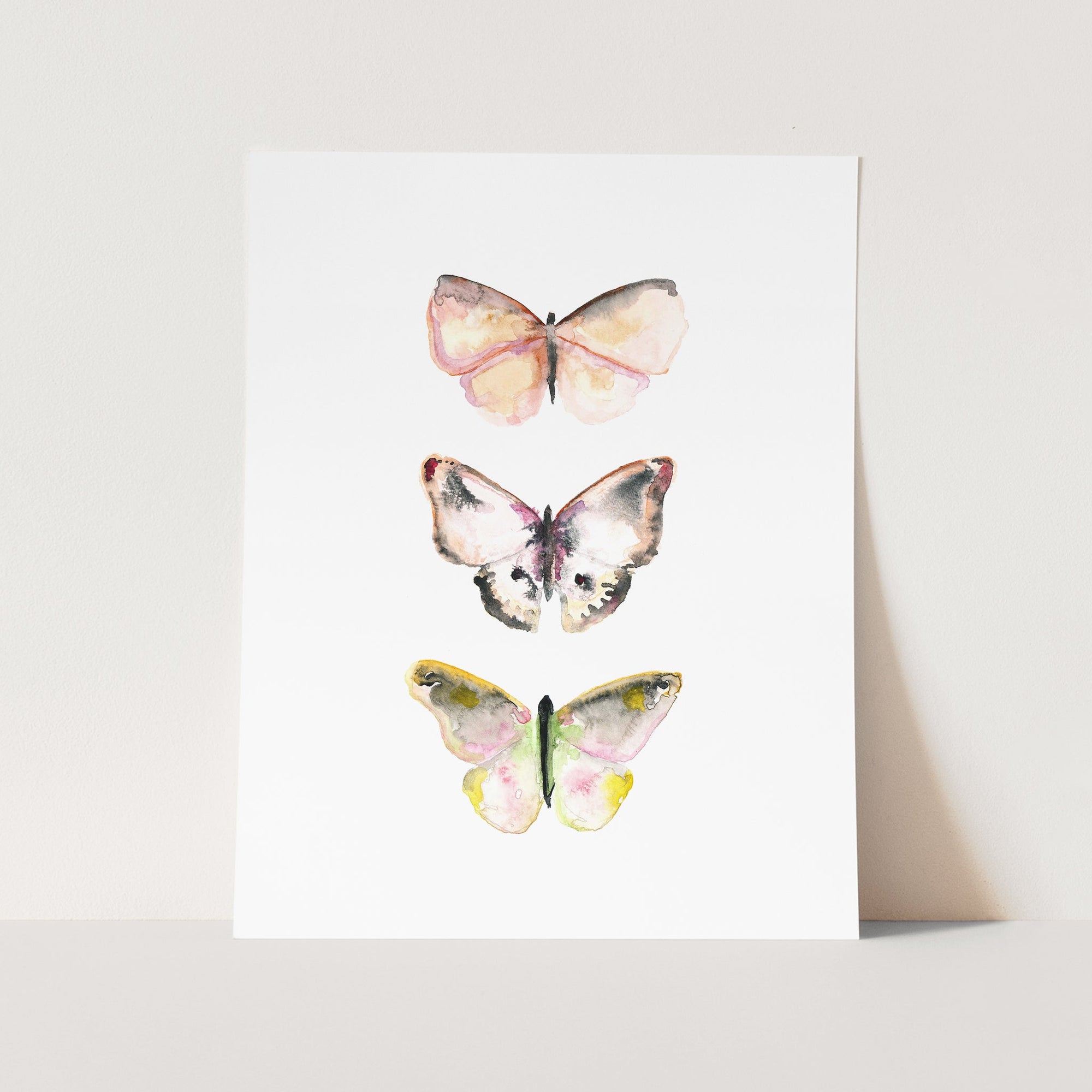 a card with three butterflies on it