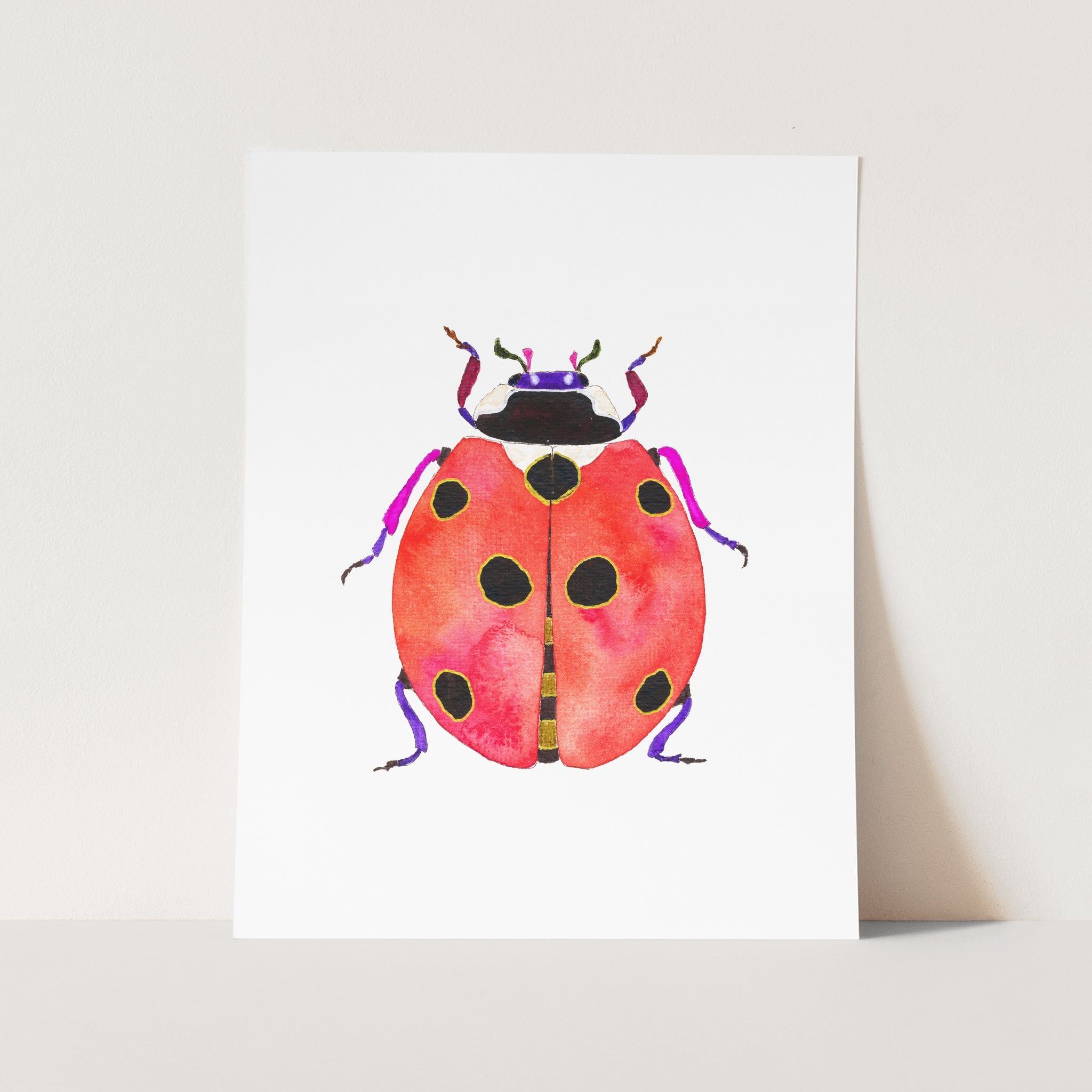 a card with a watercolor drawing of a ladybug