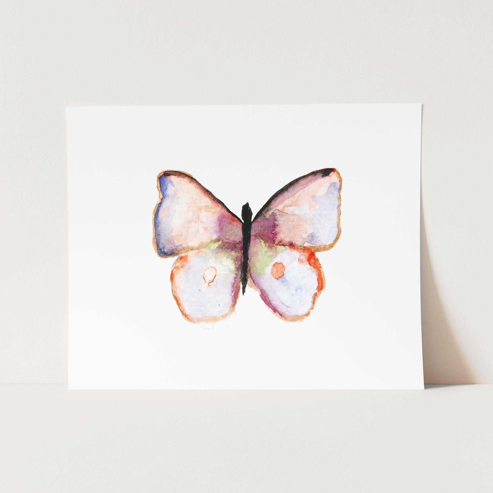 a watercolor painting of a butterfly on a card