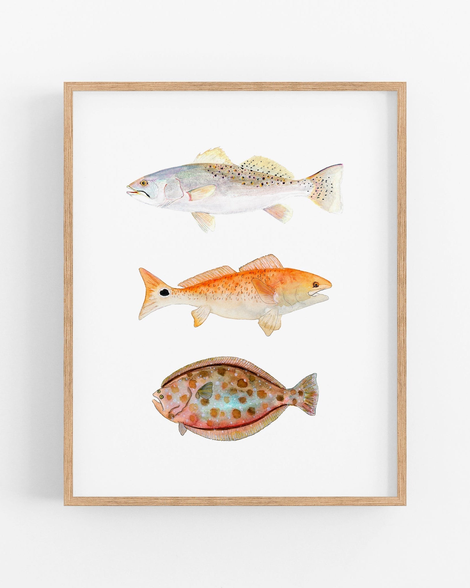 a painting of three fish on a white wall