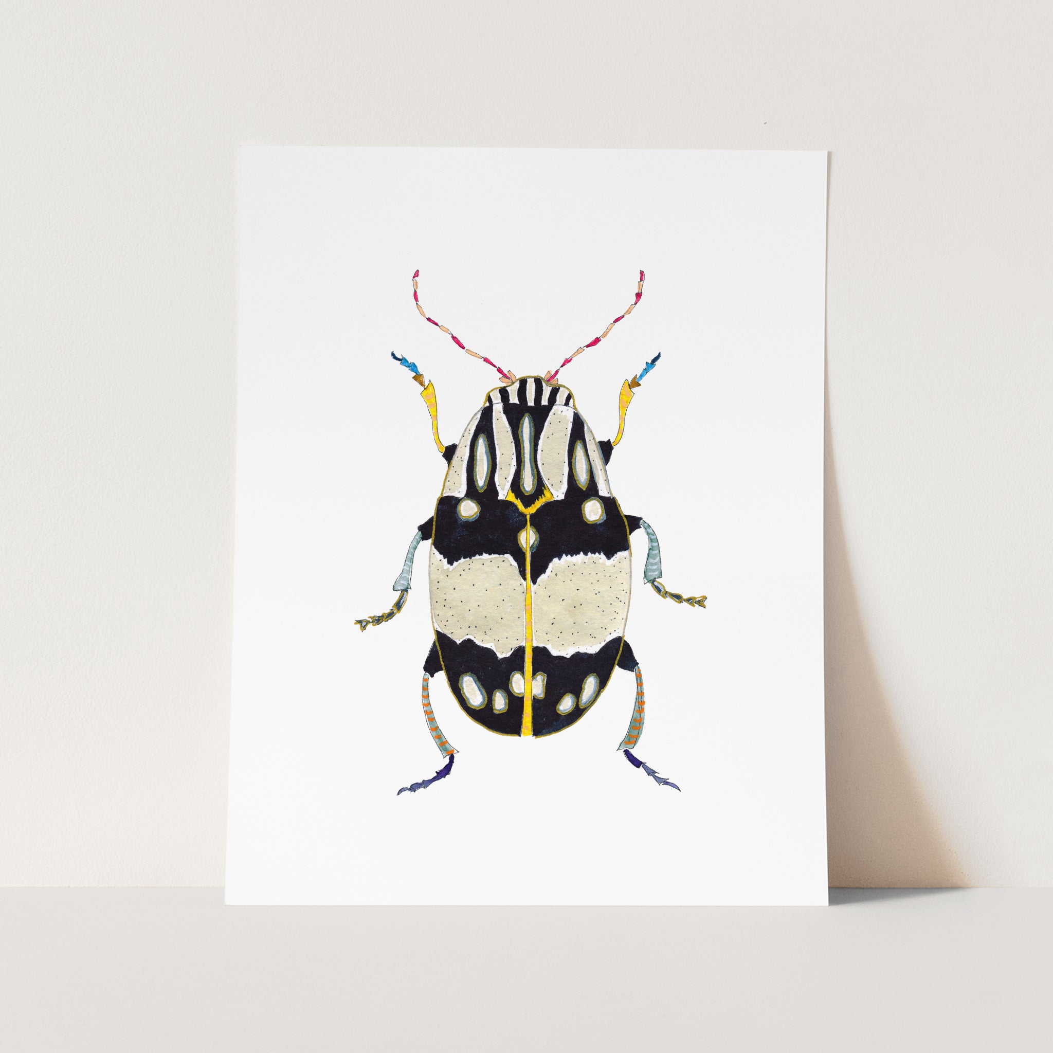 a card with a picture of a beetle on it