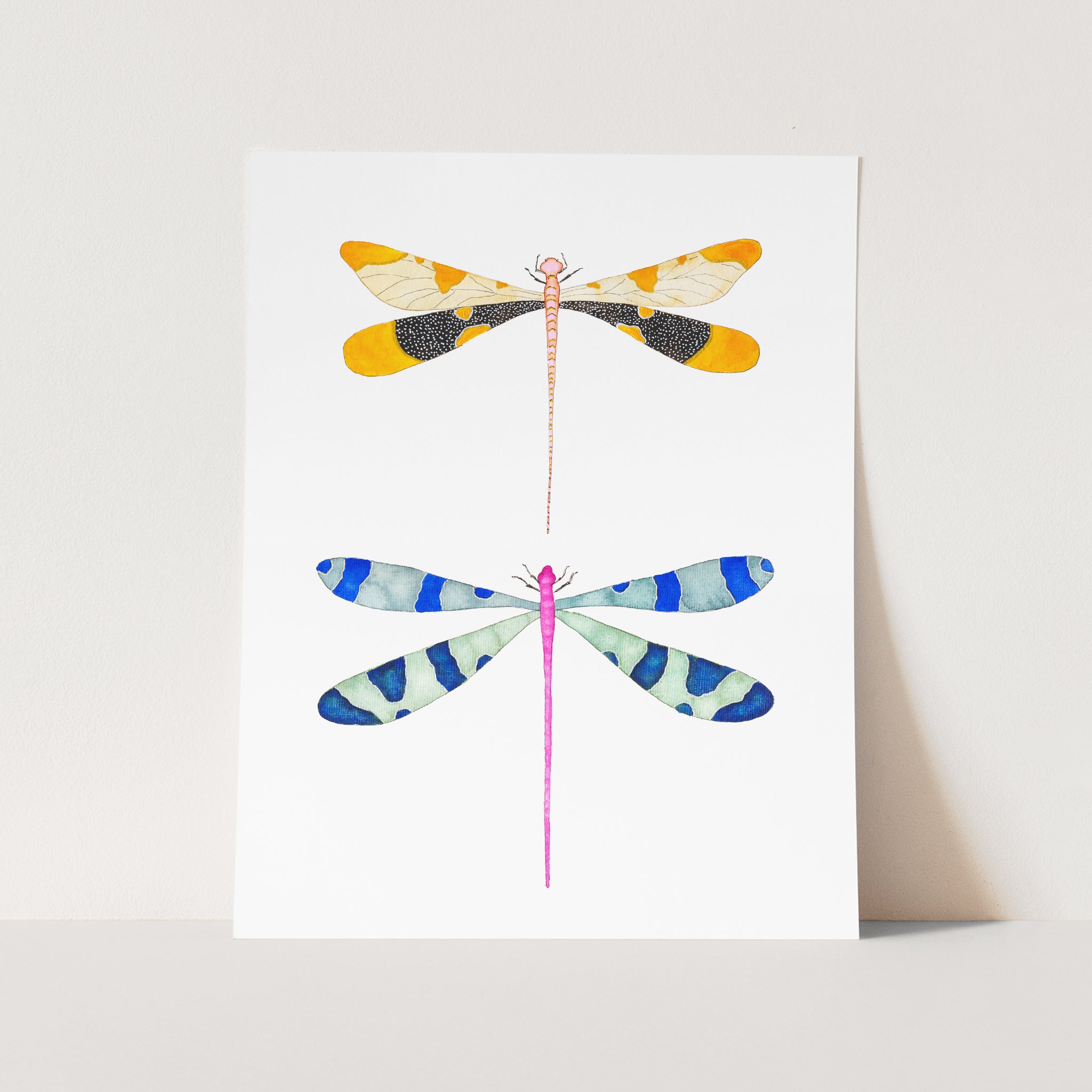 a card with three dragonflies on it