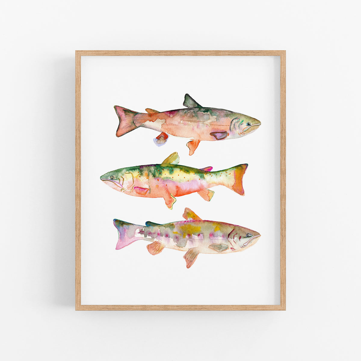 a painting of three fish on a white wall