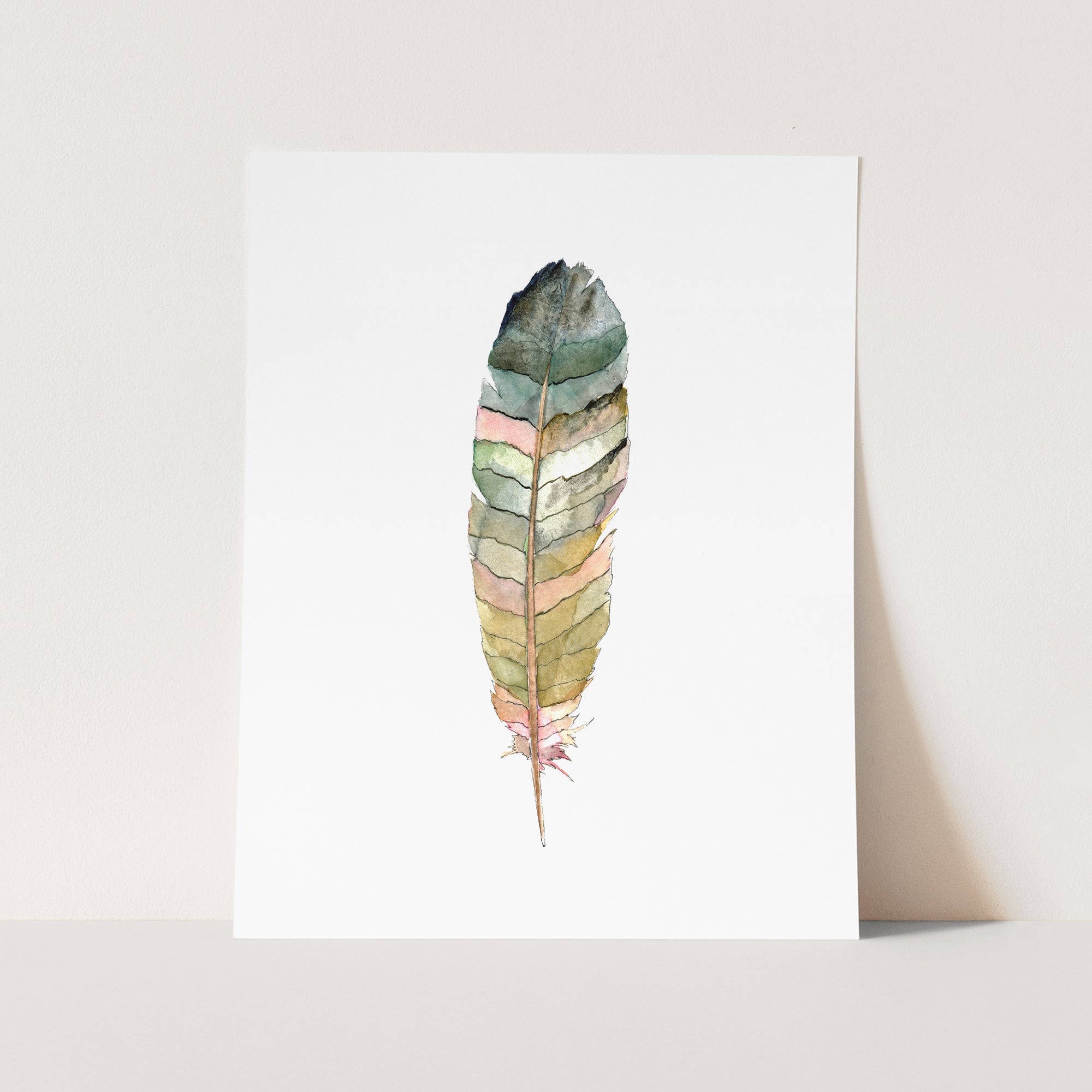 a card with a watercolor painting of a feather