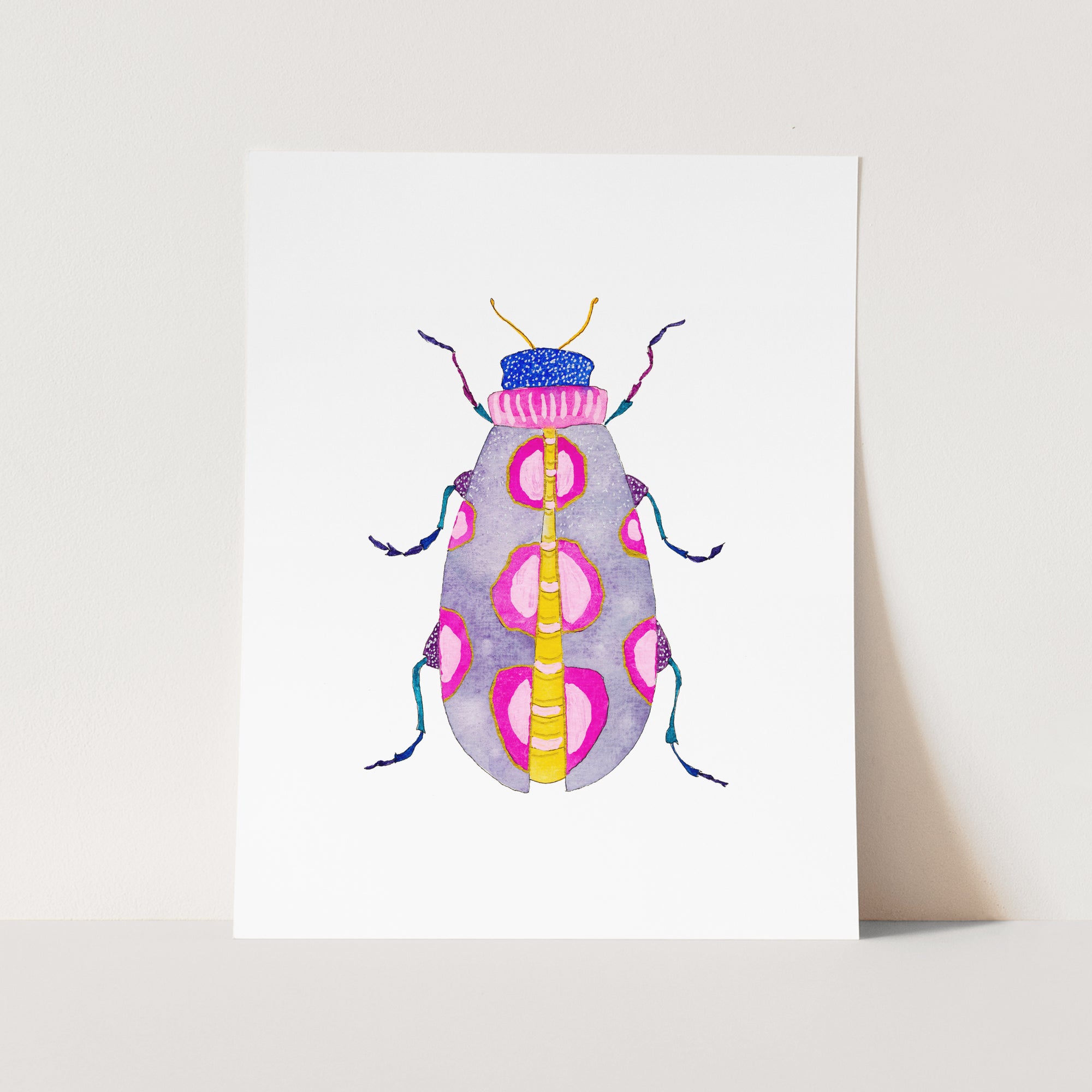 a card with a colorful bug on it