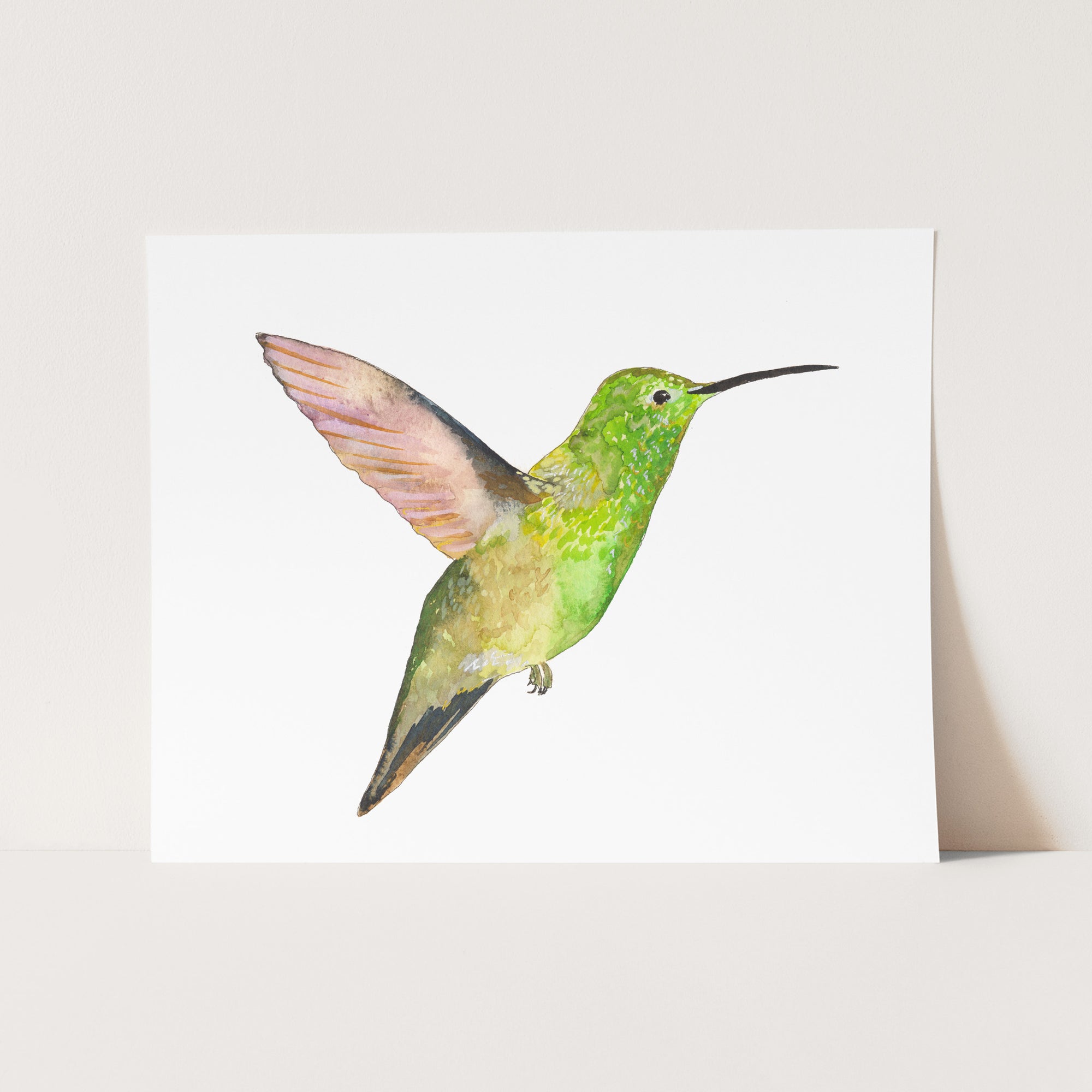 a card with a watercolor painting of a hummingbird