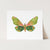 a card with a green and pink butterfly on it