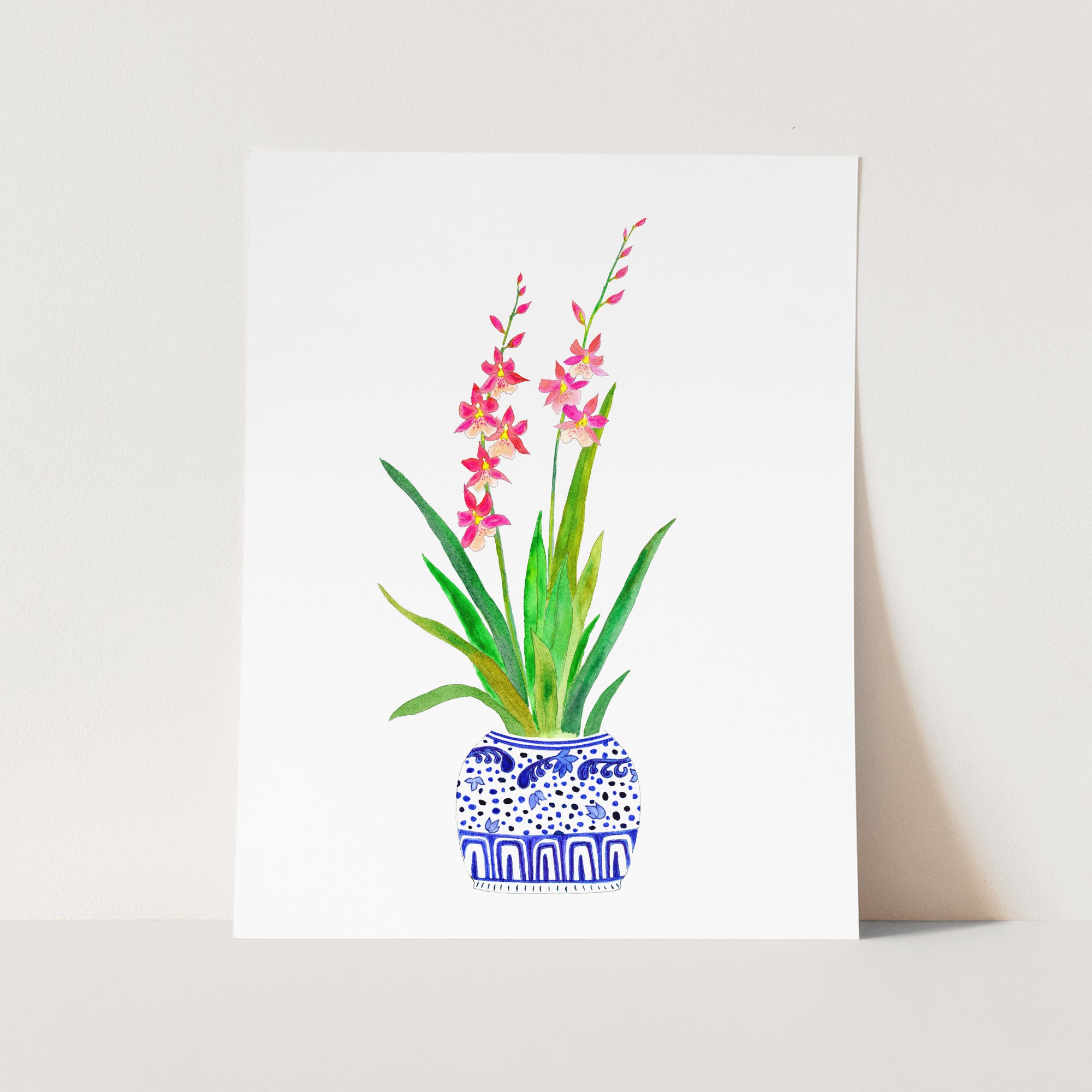 a picture of a pink flower in a blue vase