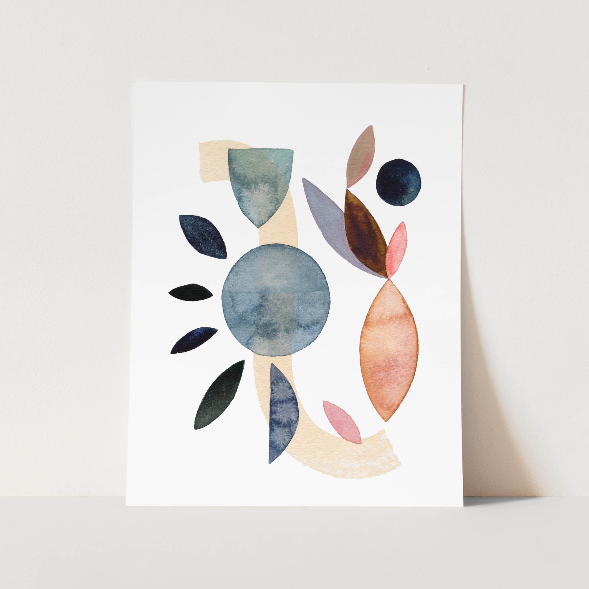 a card with a watercolor painting of leaves on it