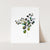 a card with a watercolor painting of a plant