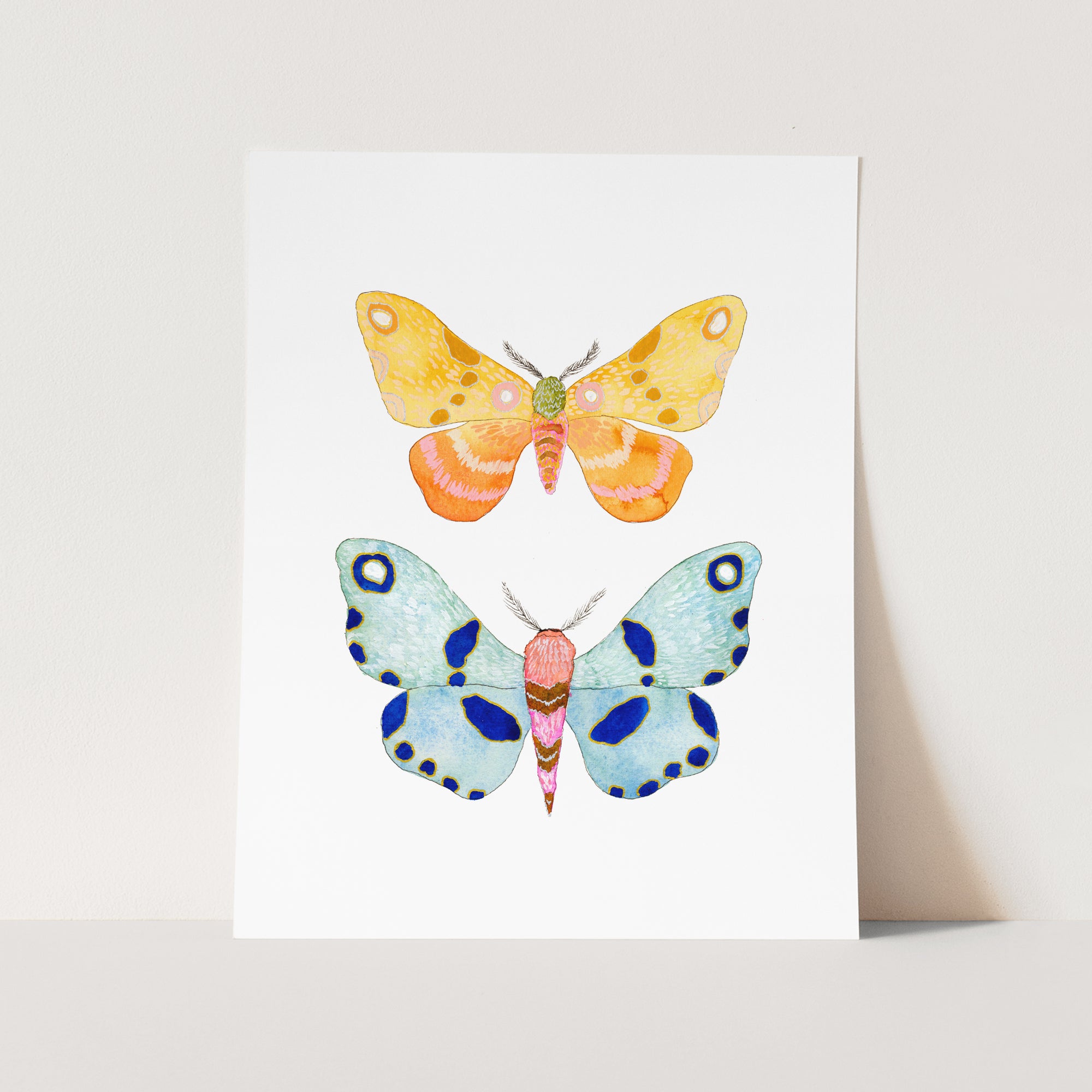 a card with three different colored butterflies on it