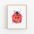 a watercolor painting of a ladybug on a white wall