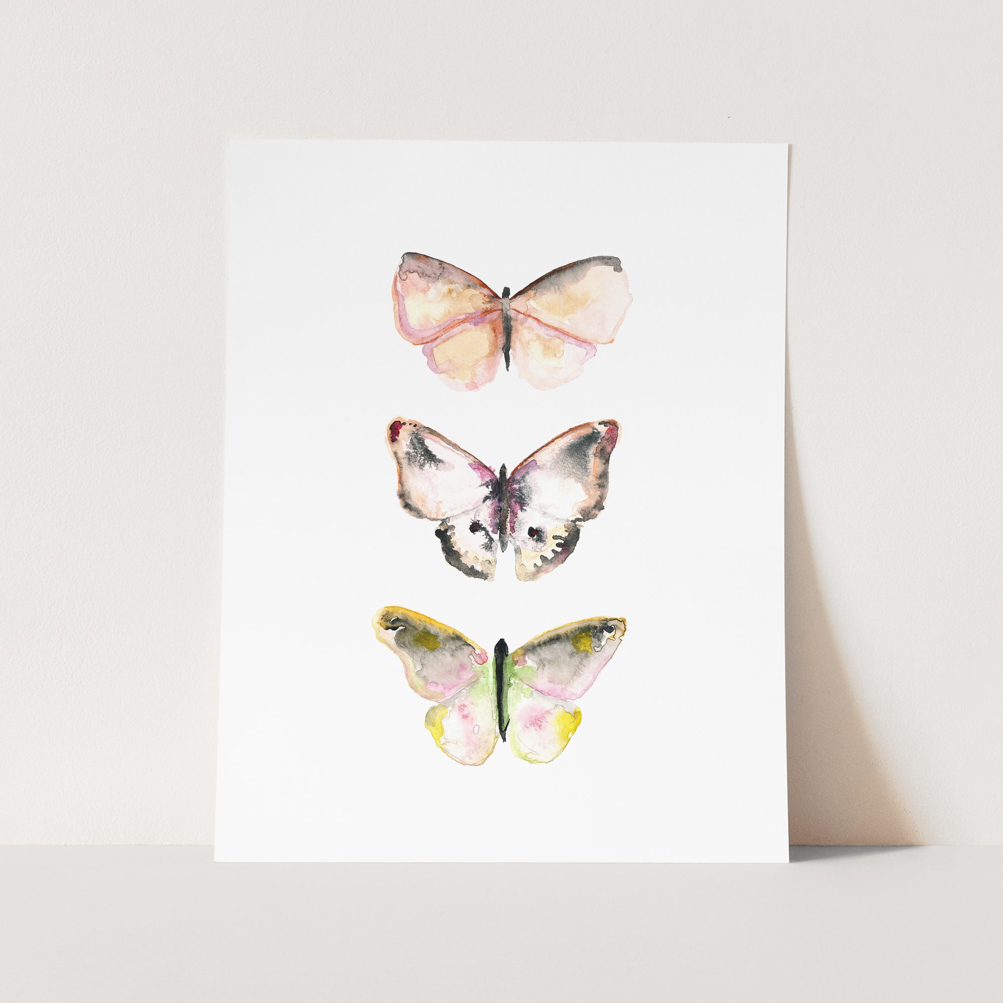 a card with three butterflies on it
