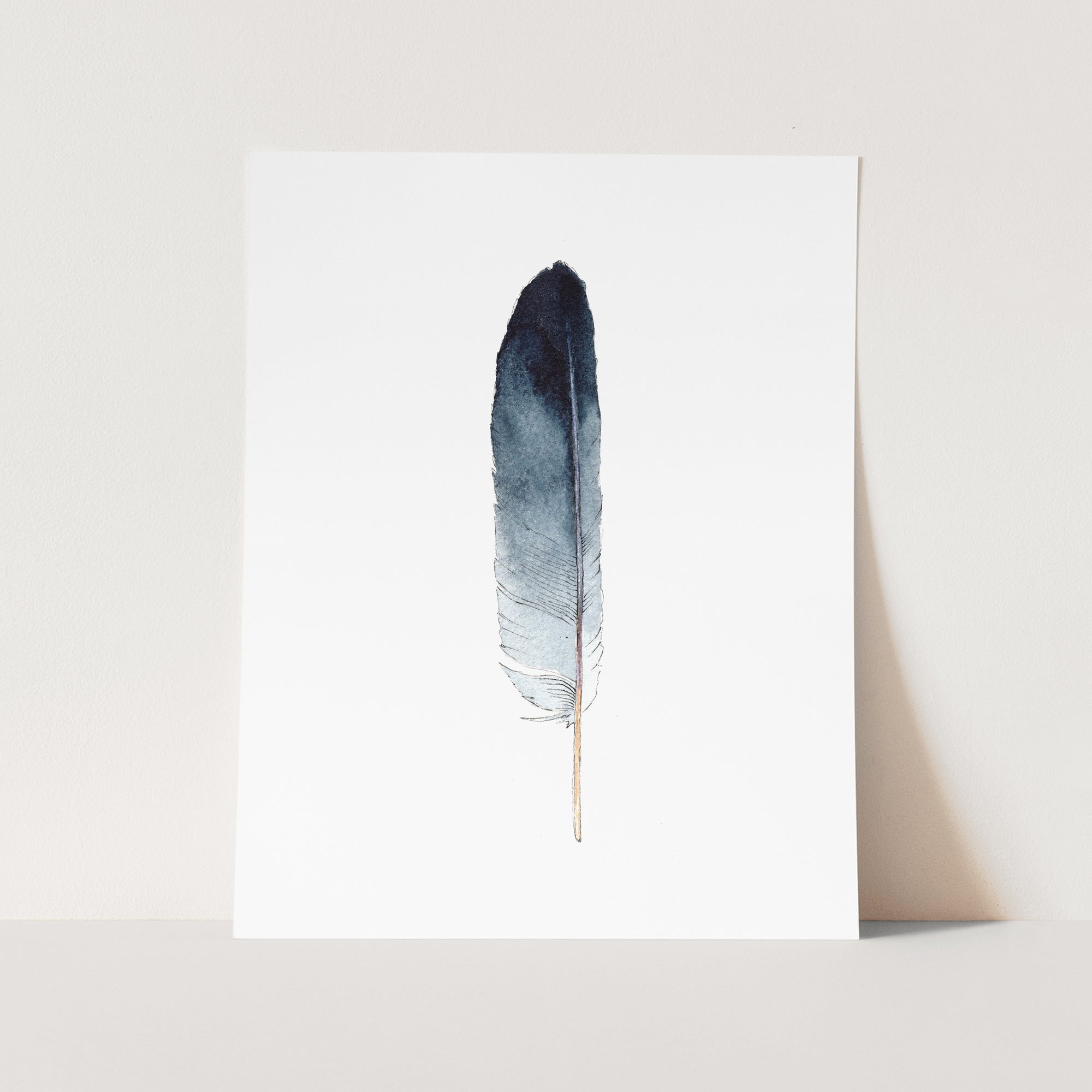 a card with a blue feather on it