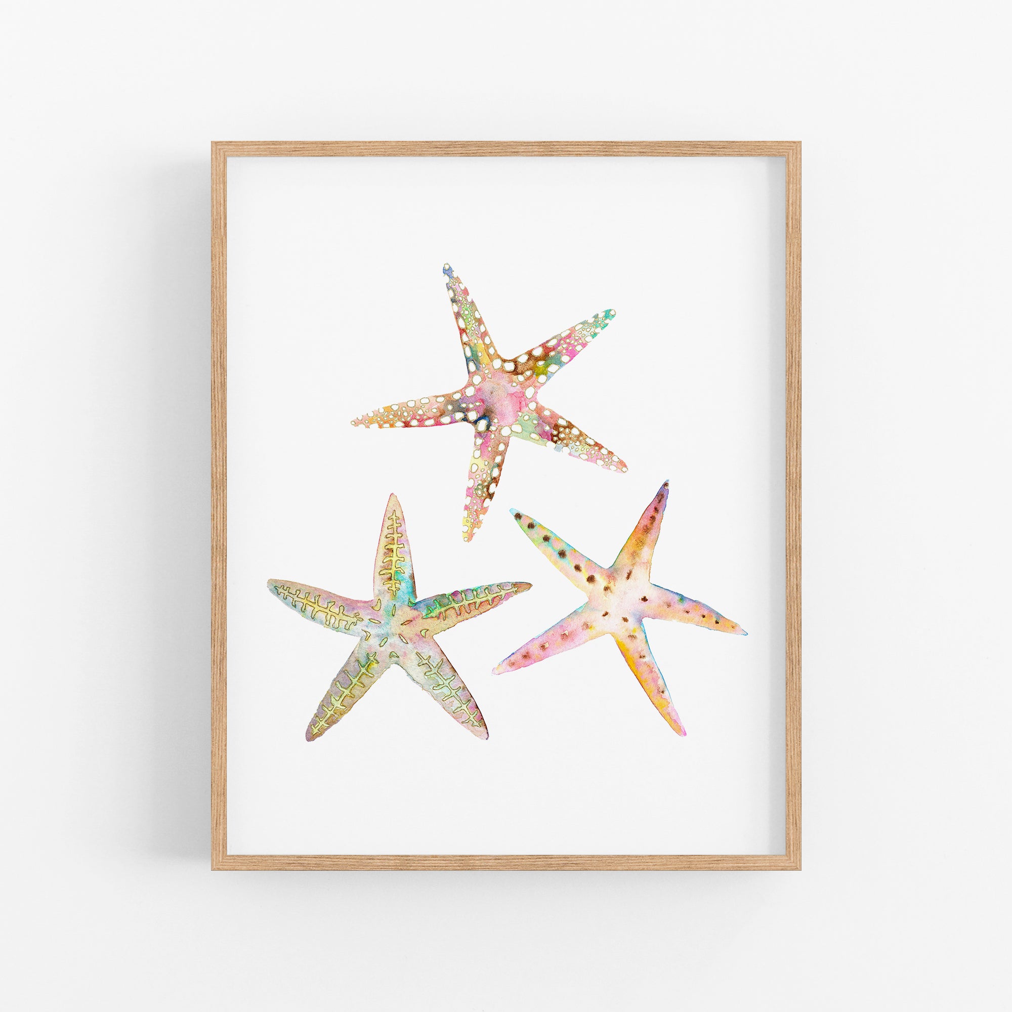 three starfishs in watercolor on a white background