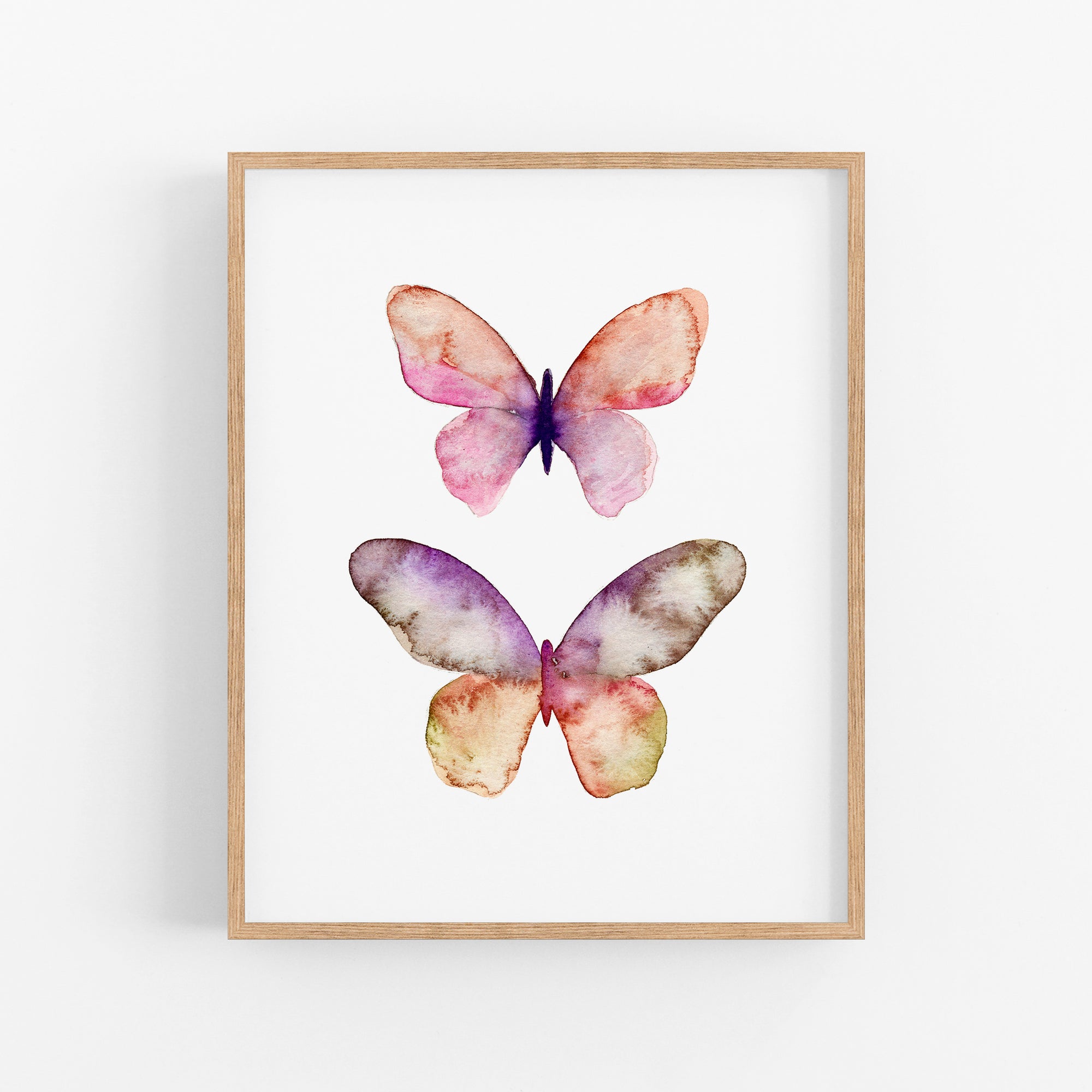 a watercolor painting of two butterflies on a white wall