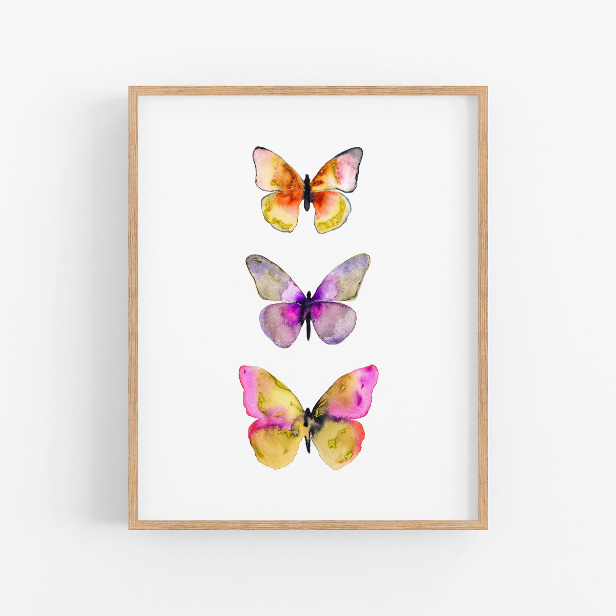 a painting of three butterflies on a white wall