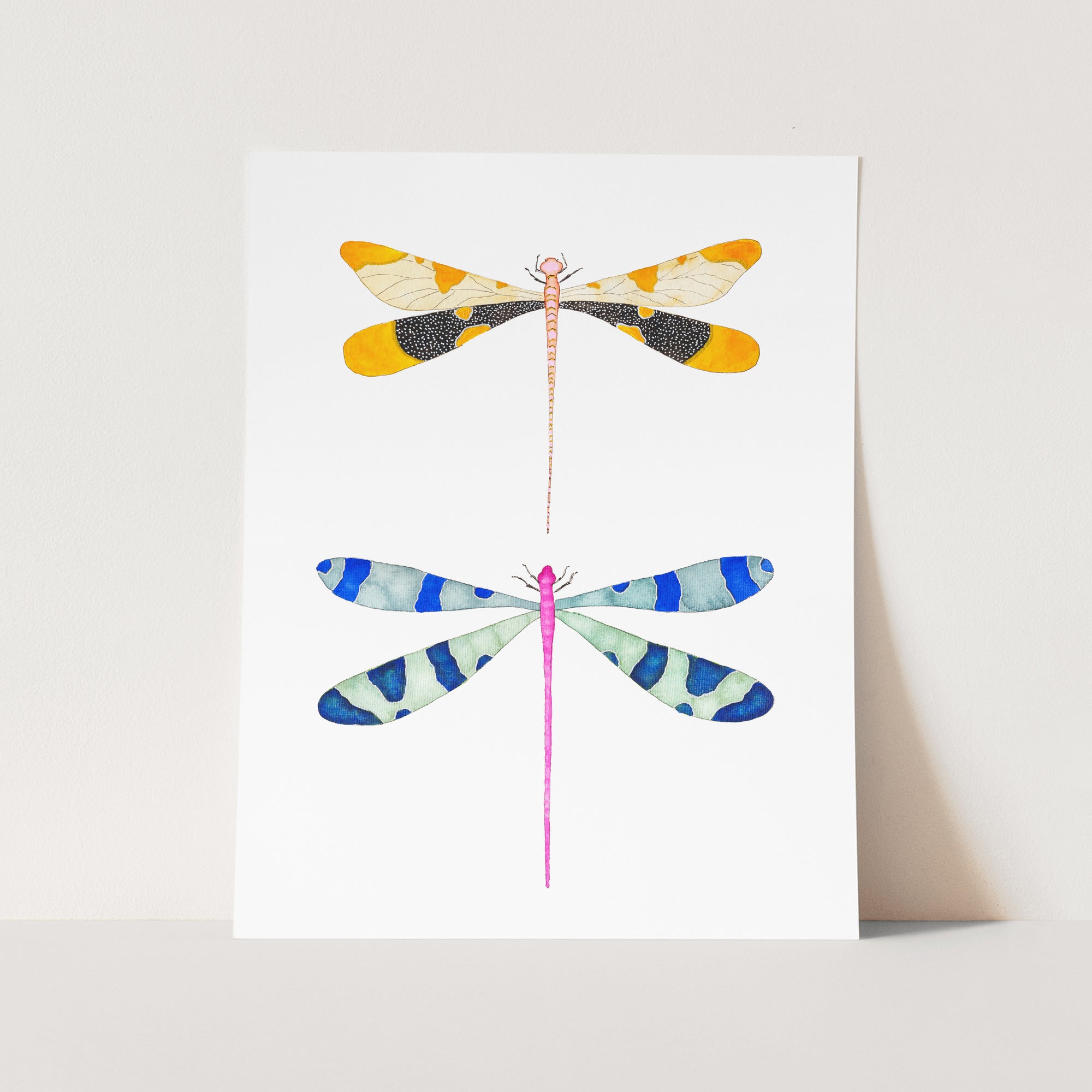 a card with three dragonflies on it